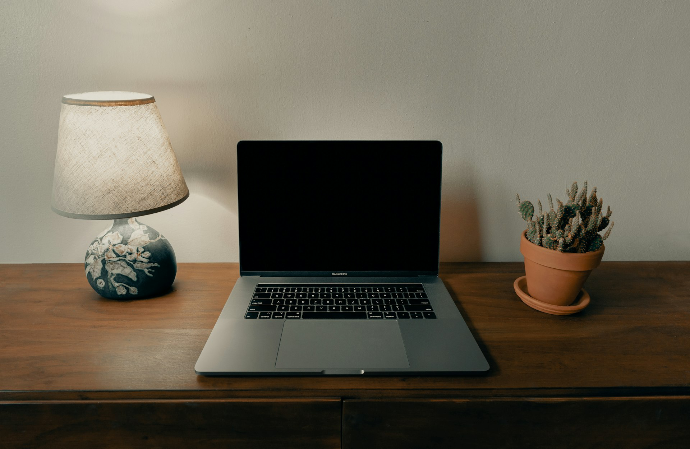 macbook pro on brown wooden table
